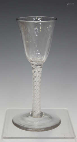 A double series opaque twist stem wine glass, mid-18th century, the rounded funnel bowl with basal