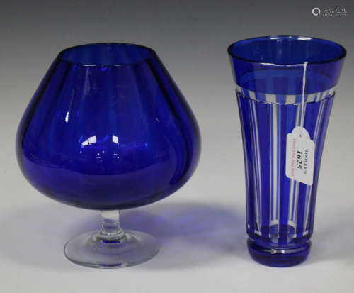 A collection of assorted blue glass, including a Nachtmann flashed vase of gently flared form, a