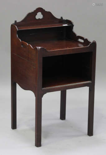 A George III mahogany night table, the galleried top fitted with a shelf and pierced with handles,
