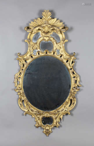 An 18th century Rococo giltwood framed wall mirror with leaf and scroll decoration, 123cm x 66cm.