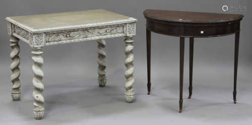 A 19th century white painted oak side table with carved foliate decoration, fitted with a frieze