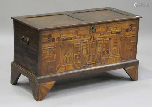 An early 20th century Italian stained beech and marquetry inlaid coffer, the panelled top above