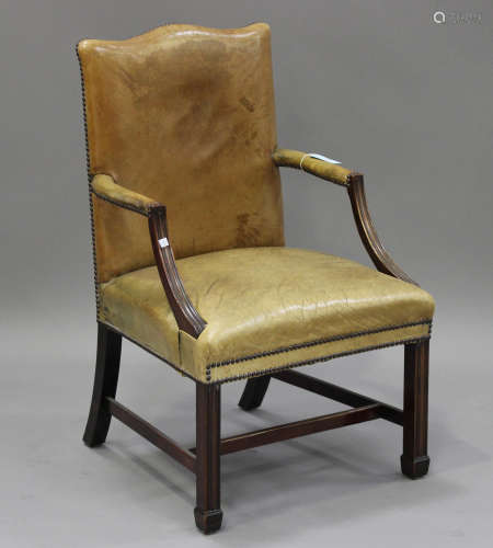 A 20th century Gainsborough style armchair, the green leather seat and back with brass studwork
