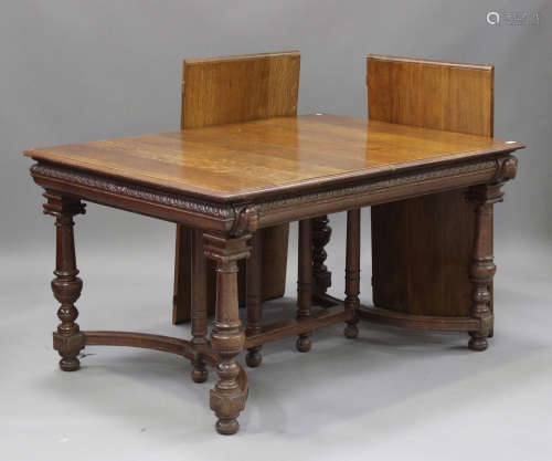 A late 19th/early 20th century French oak extending dining table, the rectangular moulded top with