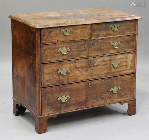 A George I walnut and boxwood line inlaid chest of two short and three graduated long drawers, on