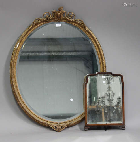 A 20th century giltwood and gesso oval wall mirror with cartouche surmount, 102cm x 80cm, together