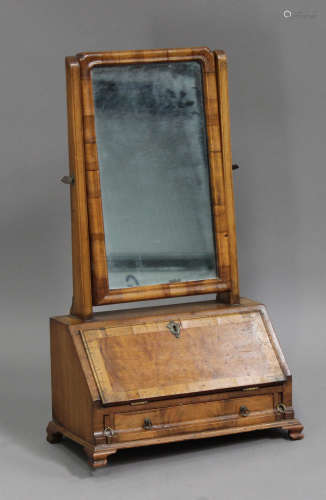A 19th century George I style walnut swing frame dressing table mirror, the fall front above a