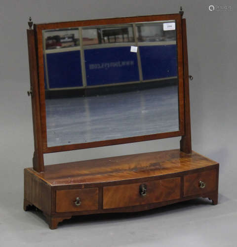 A19th century mahogany swing frame toilet mirror, the bowfront base fitted with three drawers, on