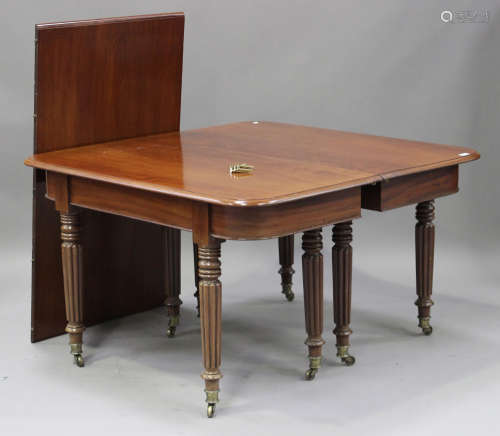 A William IV mahogany dining table with single extra leaf, the moulded top raised on turned and