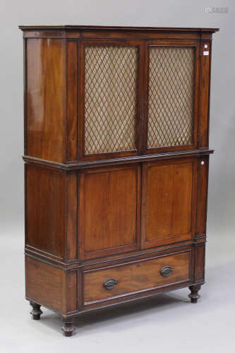 A Regency mahogany three-section side cabinet, fitted with a pair of gilt metal trellis panel