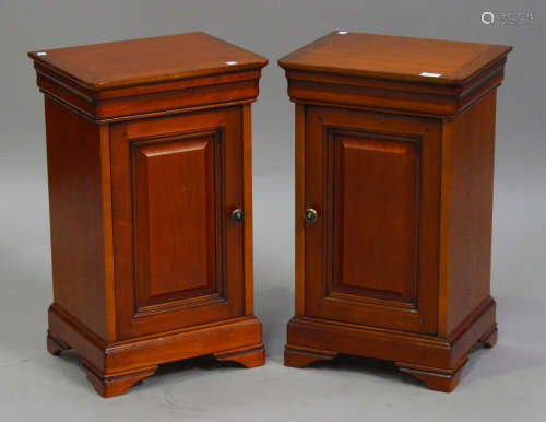A pair of late 20th century cherrywood bedside cupboards, on bracket feet, height 67cm, width