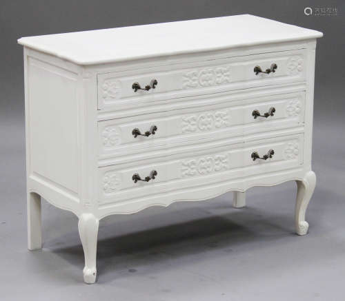 A late 20th century white painted chest of three drawers, raised on cabriole legs, height 76cm,