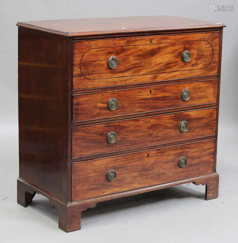 A late George III mahogany secrétaire chest, the fall front revealing pigeonholes and drawers