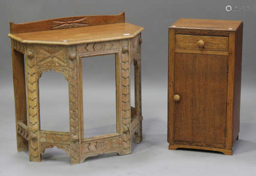 An early 20th century oak hall table, the canted top above carved supports, height 79cm, width 80cm,
