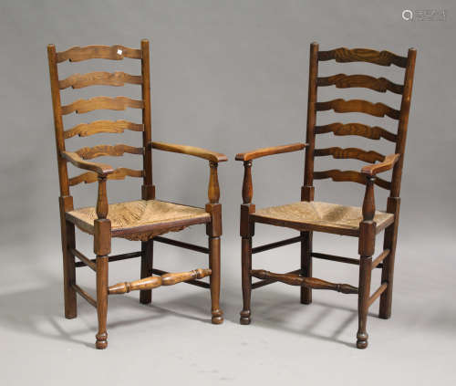 A set of eight 20th century ash ladder back dining chairs, comprising two carvers and six standard