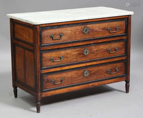 A Louis XVI walnut and ebonized commode chest, the white marble top above three long drawers flanked