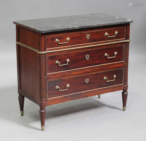 A 20th century French Louis XVI style mahogany commode chest, the grey marble top above three long