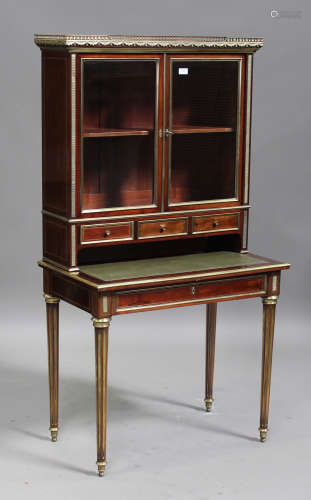 An early 20th century French Louis XVI style mahogany and brass mounted bonheur-du-jour, the