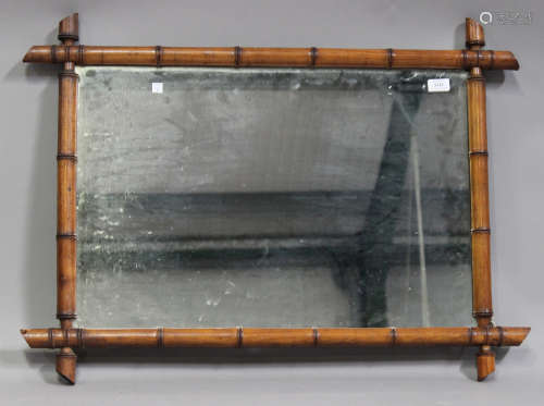 An early 20th century faux bamboo framed rectangular wall mirror, 66cm x 89cm.Buyer’s Premium 29.