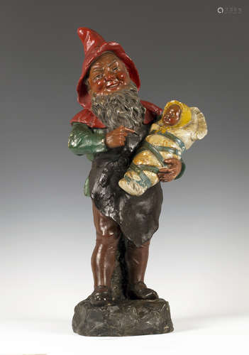 An early 20th century painted pottery figure of a gnome by Johann Maresch, finely modelled holding a