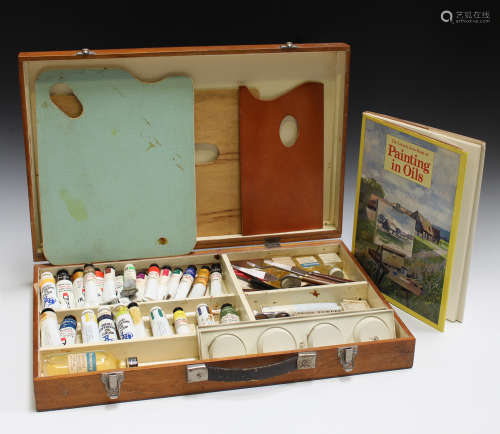 A mid/late 20th century oil painting artist's box, the interior with various oils, palette knives