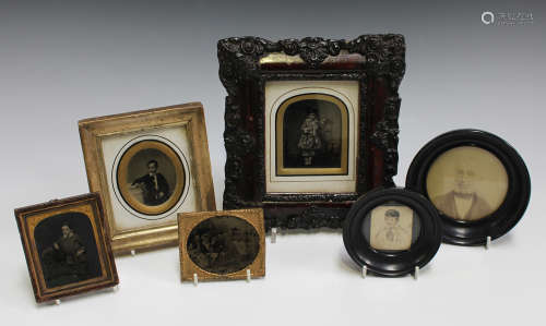 A group of four Victorian ambrotypes, a miniature watercolour of a boy and a framed photograph.