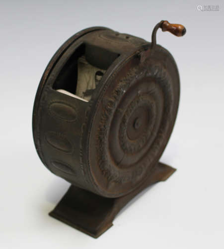 A late 19th/early 20th century French Biofix flick book turner, the cylindrical pressed metal casing