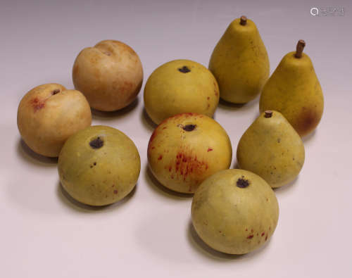 A group of 20th century Italian carved and stained marble models of fruit, including three pears,