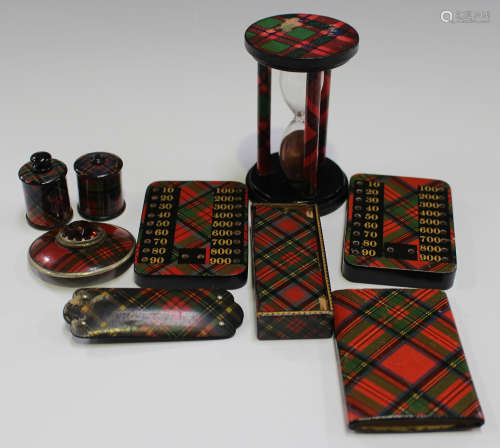 A group of Tartan ware items including two bezique markers, a sand timer, two tape measure cases and