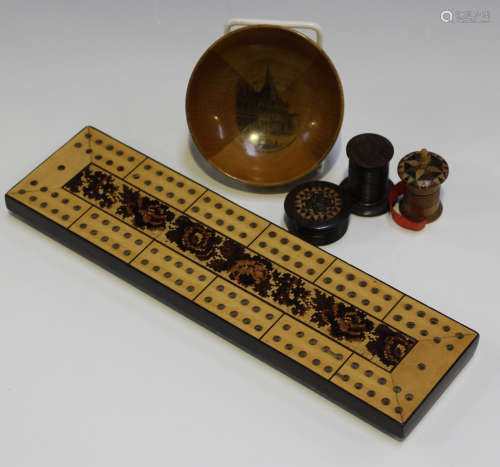 A small group of Tunbridge ware, including two tape measures, a circular box and cover, a cribbage