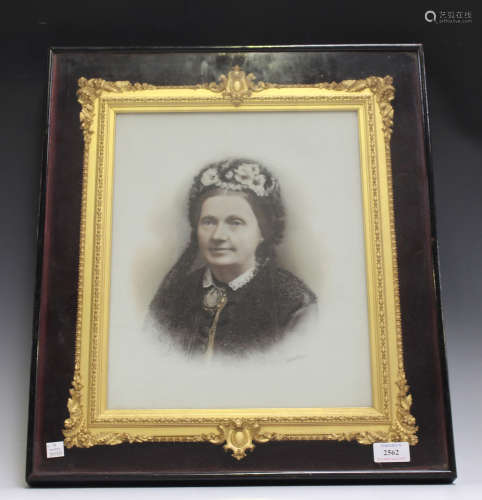 A late Victorian opalotype photograph portrait of a lady, mounted within a gilt composition frame