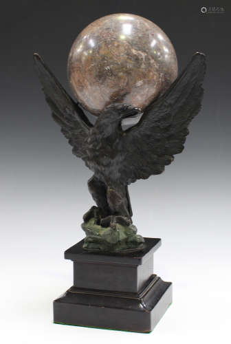 A 20th century Empire style brown and green patinated cast bronze model of an eagle with