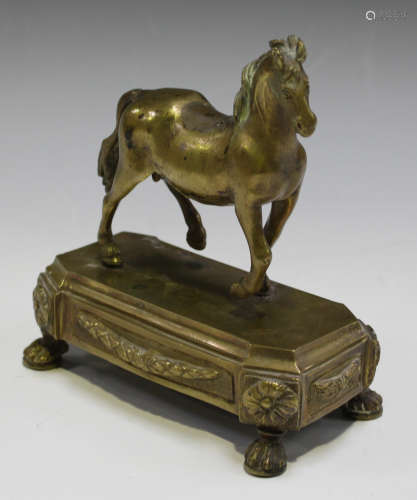A late 18th/early 19th century Venetian gilt cast bronze model of a horse, standing on a canted