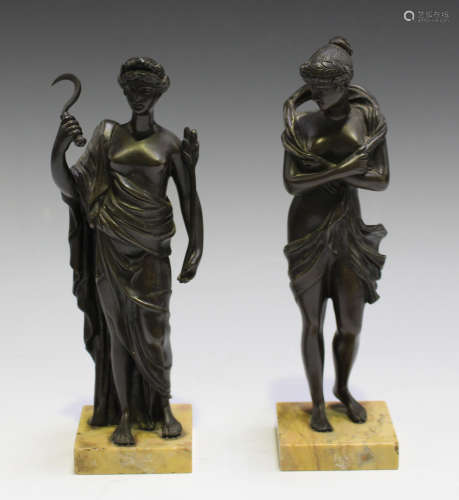 A pair of 19th century Continental brown patinated cast bronze figures of classical maidens, one