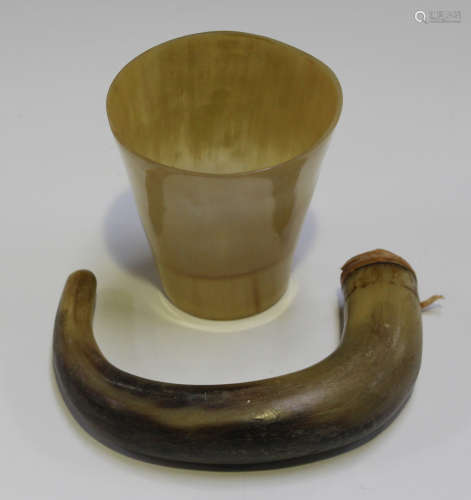 A 19th century carved horn walking stick handle and a horn beaker.Buyer’s Premium 29.4% (including