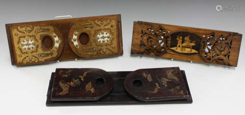 A late 19th century Sorrento ware olive wood sliding bookrack, inlaid with a reserve panel of two