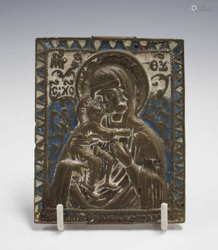 An 18th/19th century Russian cast bronze icon, decorated in relief and partially enamelled with