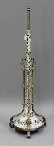 A late Victorian brass mounted and glazed porcelain adjustable floor-standing lamp standard, the
