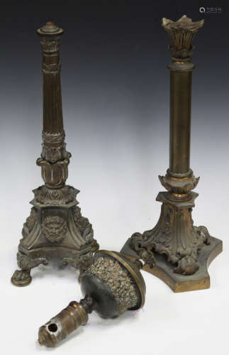 A 19th century cast bronze table lamp, the reeded stem above a flower cusp and a triform base,