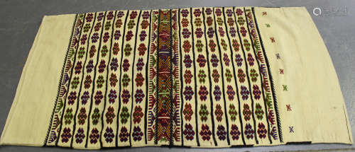 A large Turkish flatweave bag, embroidered with overall polychrome bands, 200cm x 110cm, together