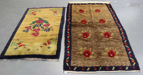 A Turkish Konya rug, late 20th century, the brown field with floral sprays, within a blue border,