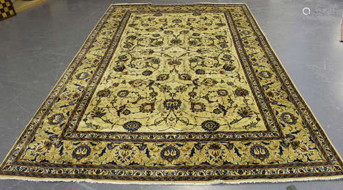 A Kashan carpet, Central Persia, late 20th century, the ivory field with overall scrolling tendrils,