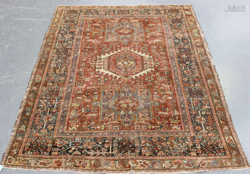 A Karajar rug, North-west Persia, early 20th century, the terracotta field with three bold