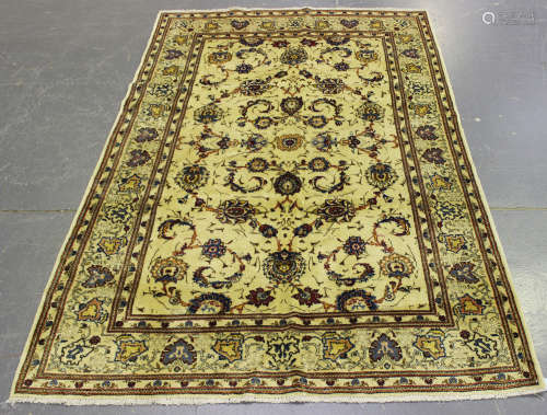 A Kashan rug, Central Persia, late 20th century, the ivory field with overall palmettes and curled