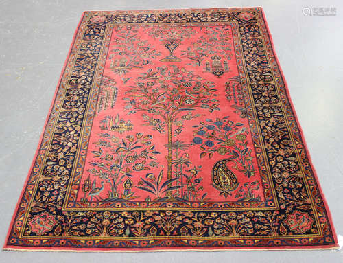 A Kerman prayer rug, Central Persia, early 20th century, the pink mihrab with an ascending central