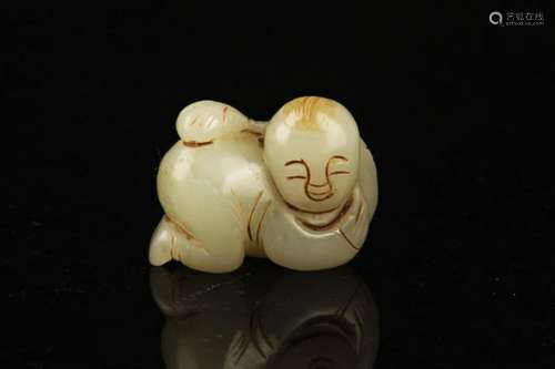 A FINE HETIAN JADE IN FIGURE OF BOY PLAYING