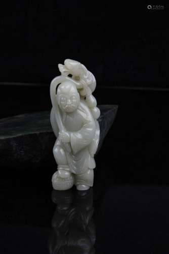 A FINE HE TIAN JADE IN FIGURE OF 