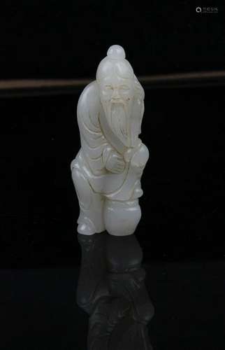 A FINE HETIAN JADE IN FIGURE OF 