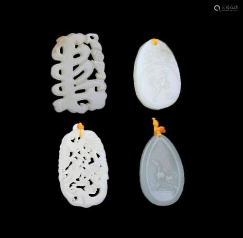 GROUP OF FOUR FINELY CARVED JADE PENDANT