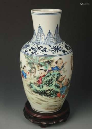 A BLUE AND WHITE FAMILLE ROSE GUAN YIN VASE